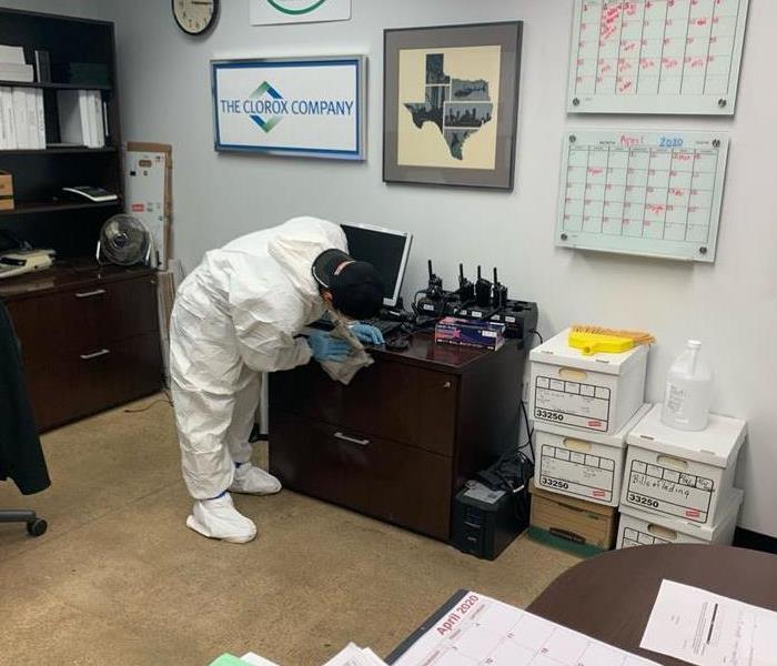 Team member cleaning an office space.