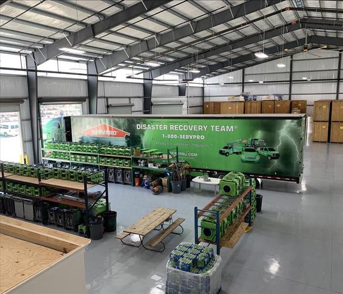 large trucks and equipment in a warehouse