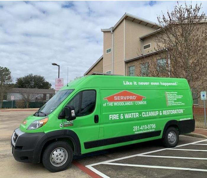 SERVPRO van parked on site.